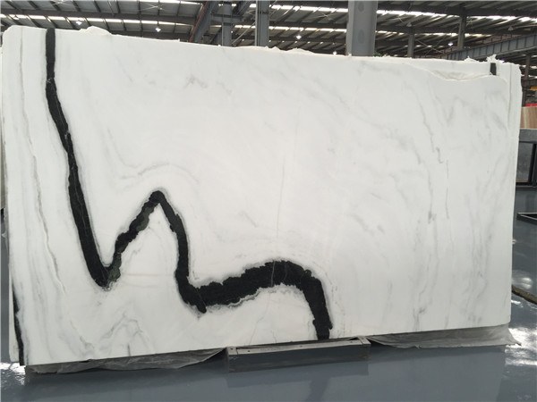A full marble slab face, 290 by 165cm, with a single bold diagonal vein running corner to corner