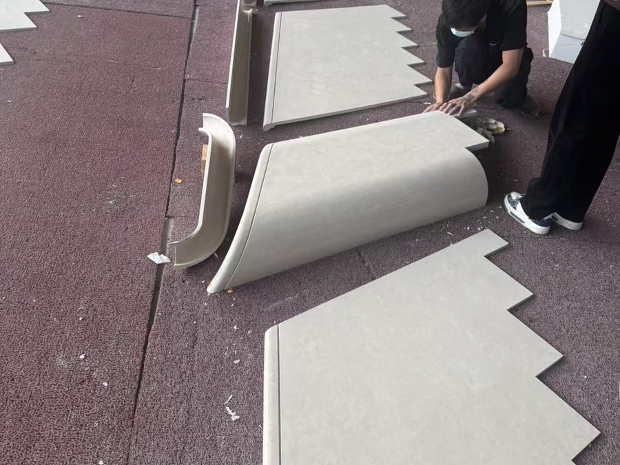 Ottoman Beige marble shaped pieces being dry-fitted together on the factory floor